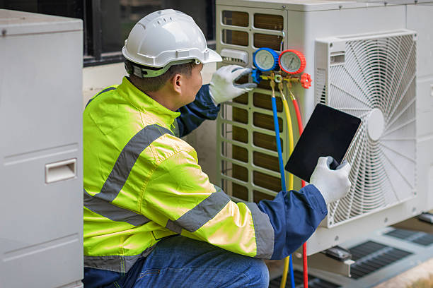 Professional Heat Pump Repair technician working in Dewitt, IL